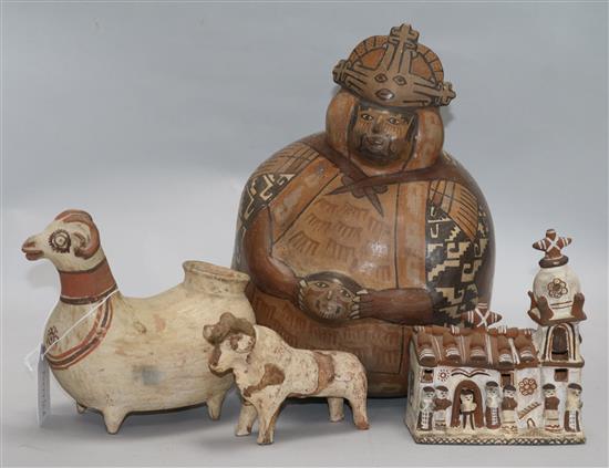 Peruvian pottery - a Nazca style flask, a Llama shaped vessel, a model of a church and a model of a bull,